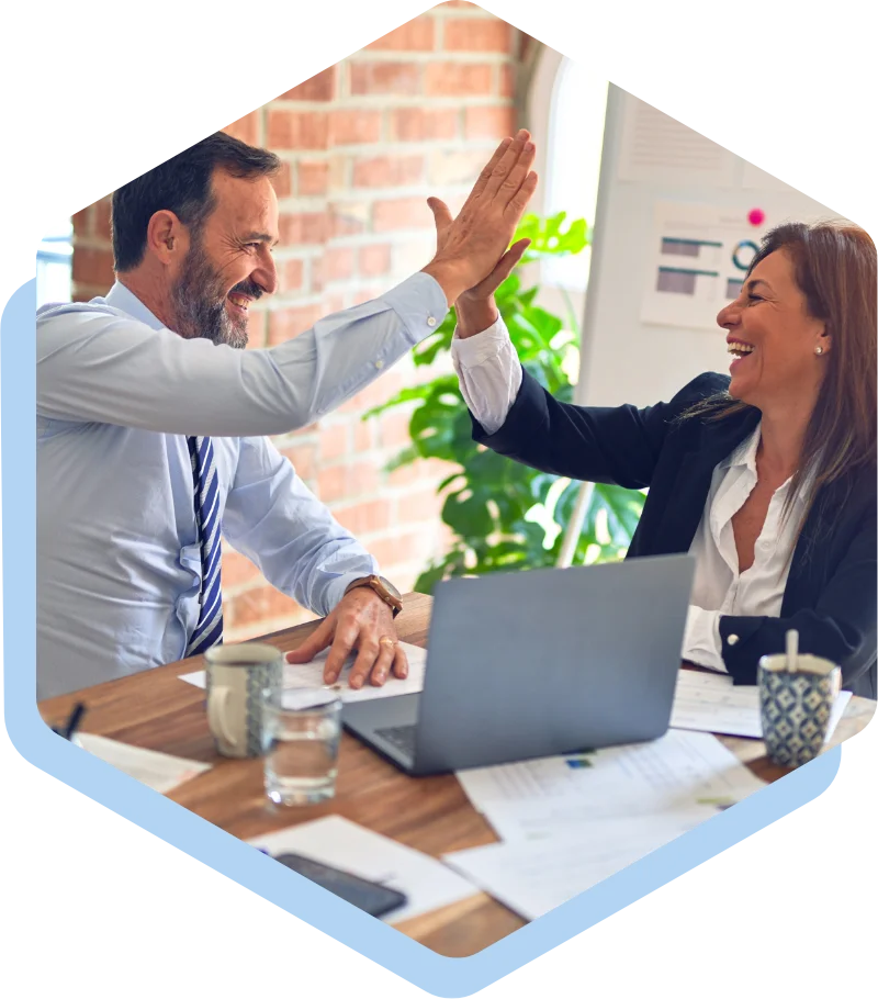 Man and woman celebrating with a high five.