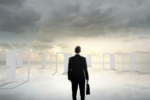 Man deciding which door to go through